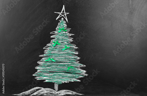 Fir tree drawing on blackboard. Xmas background