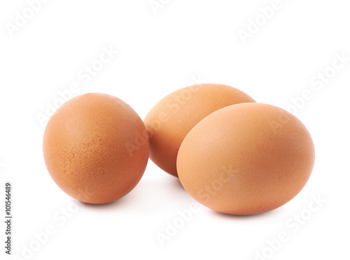 Three brown eggs composition isolated