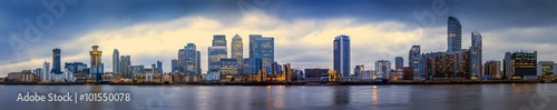 Wide panoramic skyline of Canary Wharf, the worlds leading financial district at blue hour - London, UK
 photo
