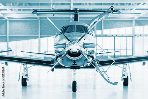 Fotomurale Single turboprop aircraft in hangar.