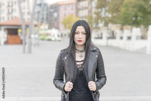 Urban portrait of beautiful woman heavy metal style. © leonardo2011