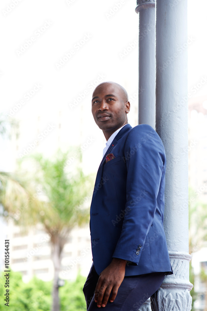 Handsome young african businessman looking away Handsome young african businessman looking away