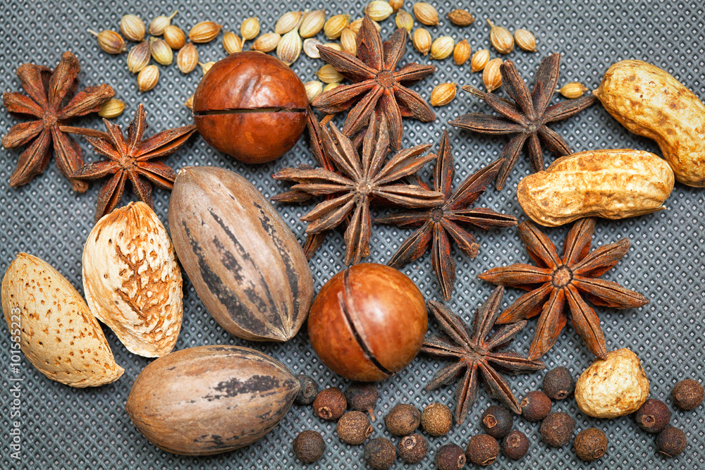 pecans, almonds, macadamia, peanuts, star anise, black allspice, grains of sesame seeds pecans, almonds, macadamia, peanuts, star anise, black allspice, grains of sesame seeds