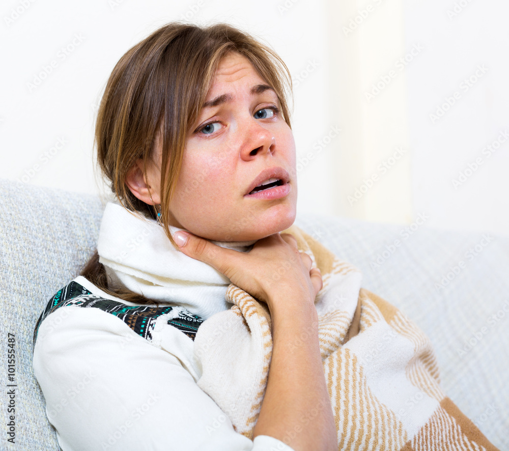 Naklejka premium Girl suffering of sore throat