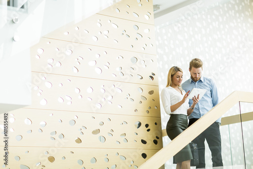 Young couple on stairs in t...