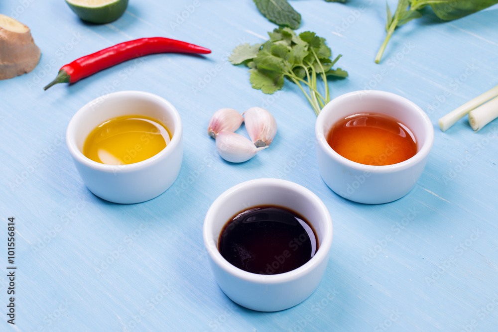 Food ingredients and kitchen utensils for cooking on wooden background Food ingredients and kitchen utensils for cooking on wooden background