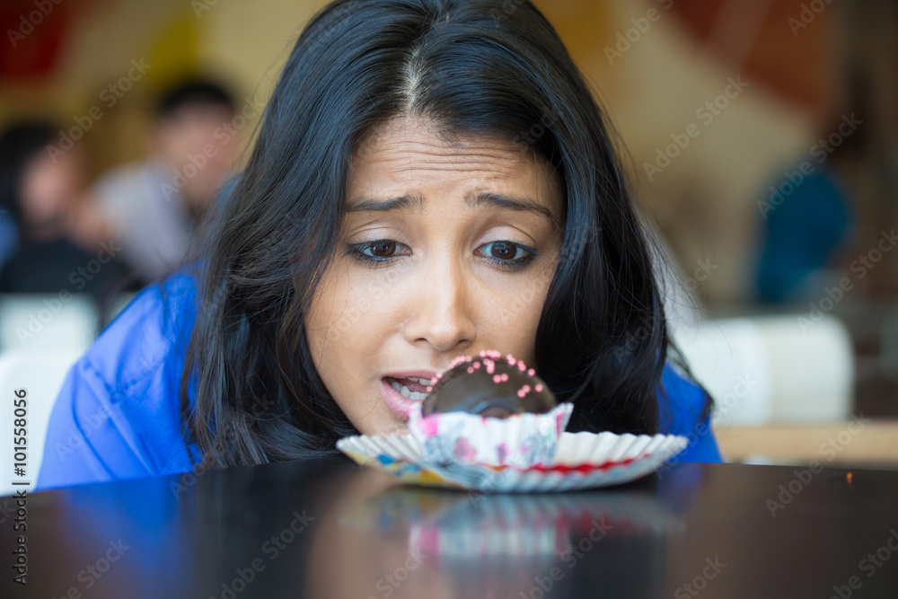 Φωτογραφία Closeup portrait of desperate woman in blue shirt craving fudge with pink sprink