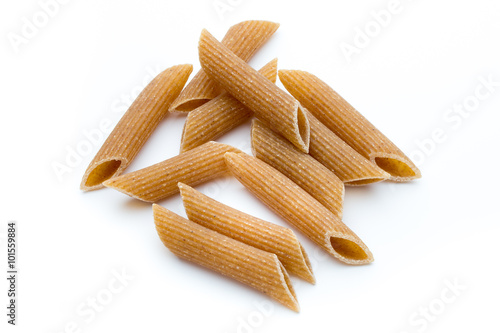 Rye flour macaroni pasta close up isolated on white.