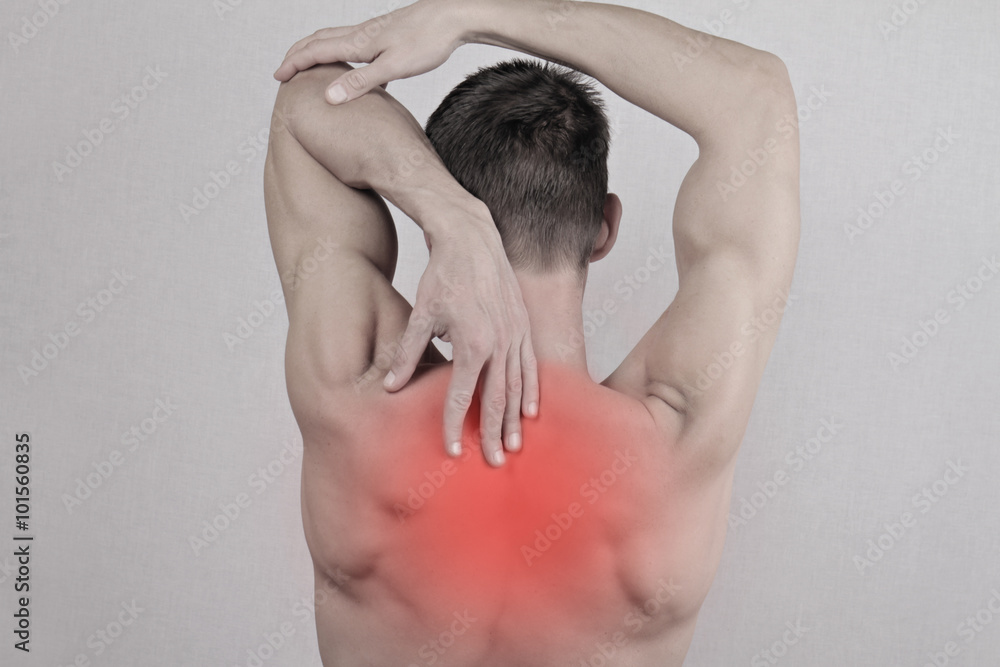 Man with neck and back pain. Man rubbing his painful back close up. Pain relief concept Man with neck and back pain. Man rubbing his painful back close up. Pain relief concept