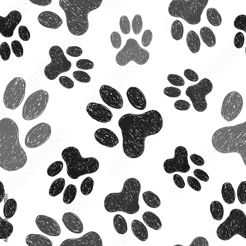 Paws print seamless pattern. Vector background with doodle dogs paws. 