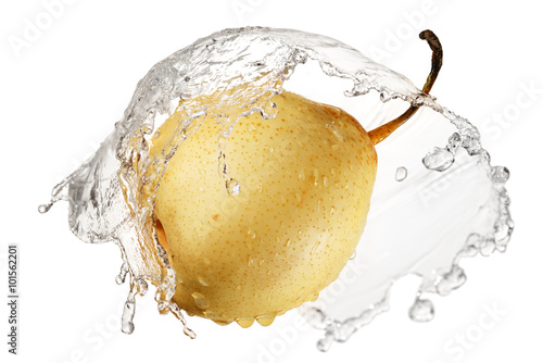 Yellow pear in splash of water