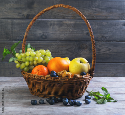 Wicker straw basket with an assortment of fruits