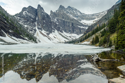 mountains reflections in Agnes Lake, Banff national park, Alberta, Canada