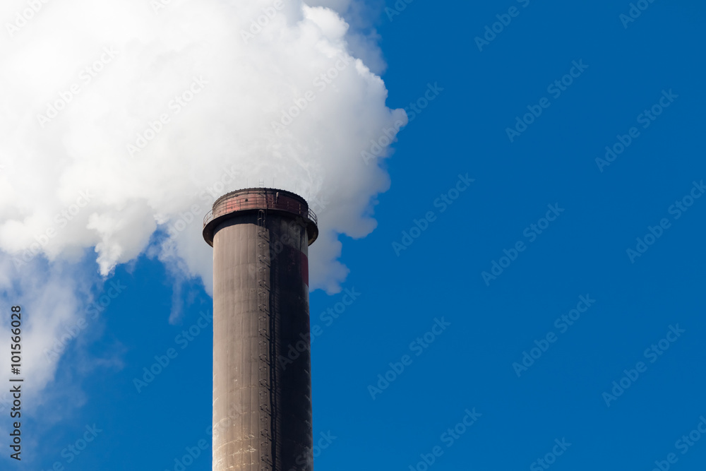 Industrial exhaust pipe with smoke against the sky Industrial exhaust pipe with smoke against the sky