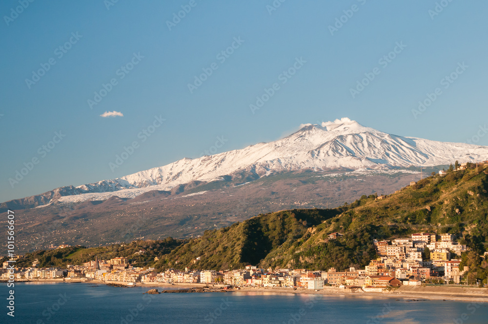 View of the touristic village Giardini Naxos, Eastsicily, in the early morning with a view of Mount Etna