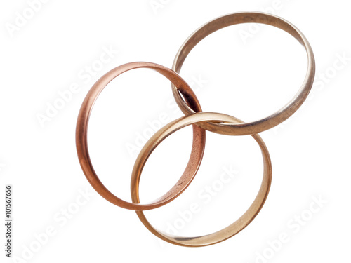 Three interlocking wedding rings. Modern marriage? Bigamy? photo