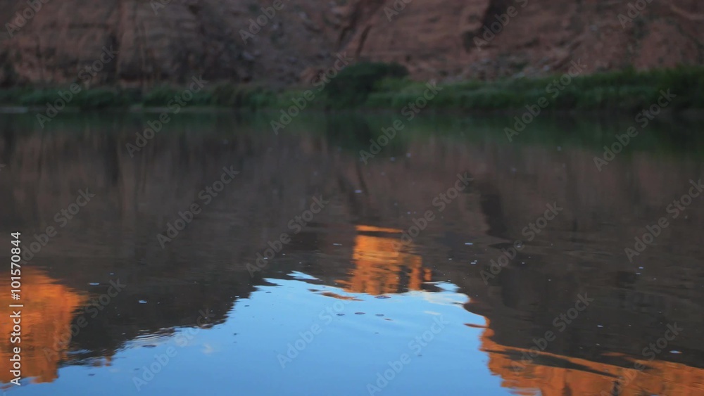 Water ripples in front of the red rocks of the Green River in Southeastern Utah. Water ripples in front of the red rocks of the Green River in Southeastern Utah.