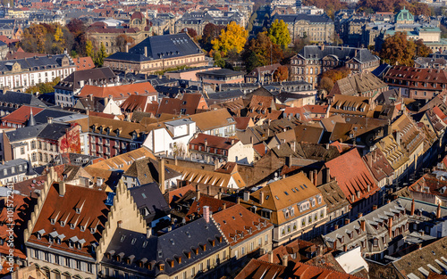 Vivid medieval house roofs covered with traditional red and orange tiles in Strasbourg city