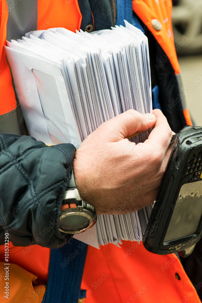 Fotografie postman holding letters on his hand