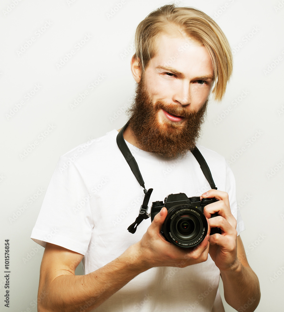Fototapeta premium bearded man with a digital camera