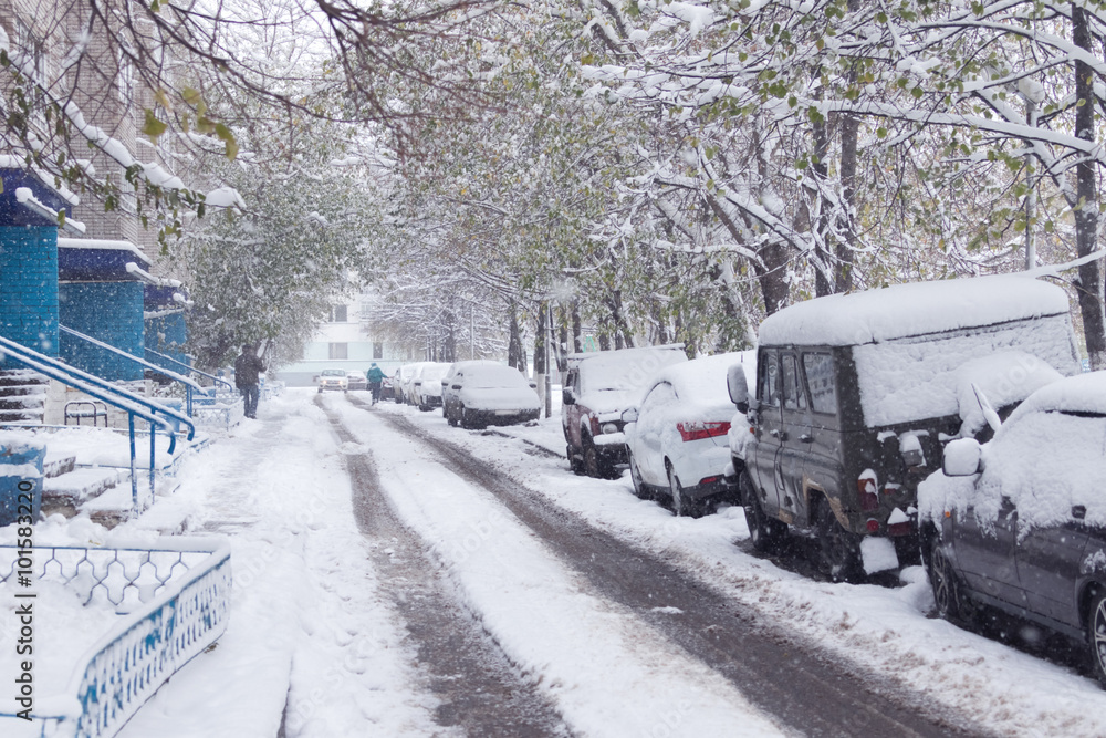 The disaster on the street car by the roadside in the snow, one passerby The disaster on the street car by the roadside in the snow, one passerby