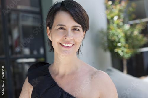 Happy latin adult woman smiling