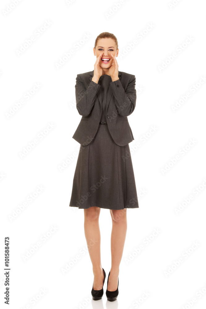 Young smiling business woman screaming loud or calling someone Young smiling business woman screaming loud or calling someone