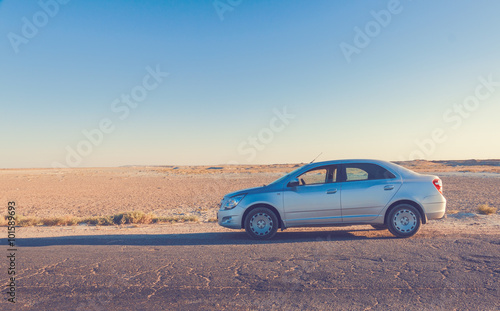 Car on road in prairie © eranicle