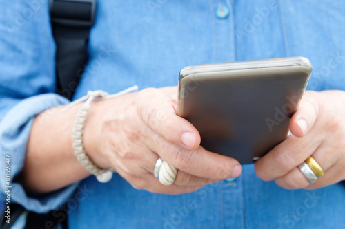 image of older woman using smart phone