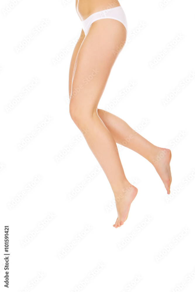 Legs and bottom of jumping woman in white panties Legs and bottom of jumping woman in white panties