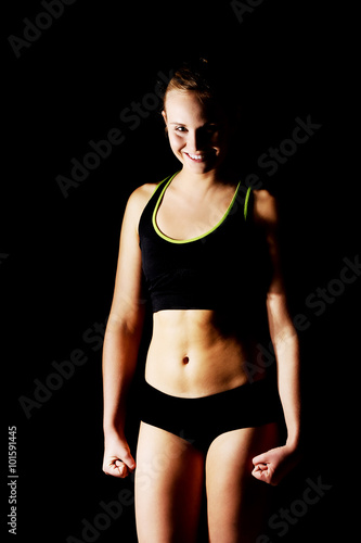 Young athletic woman in black sports underwear © Piotr Marcinski
