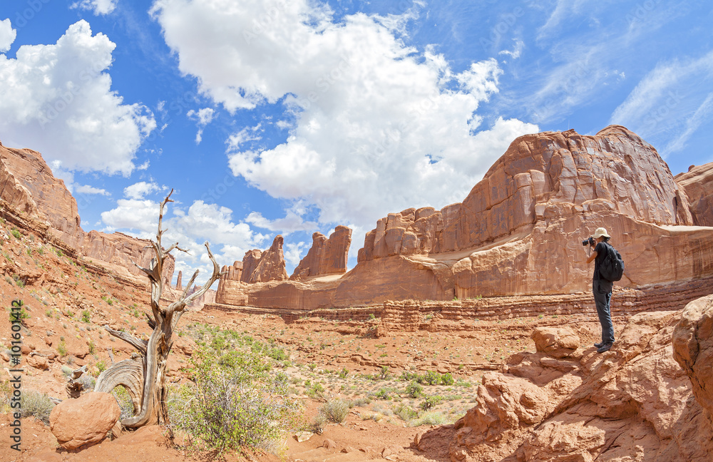 Tourist taking pictures of a beautiful scenery, Utah, USA. Tourist taking pictures of a beautiful scenery, Utah, USA.