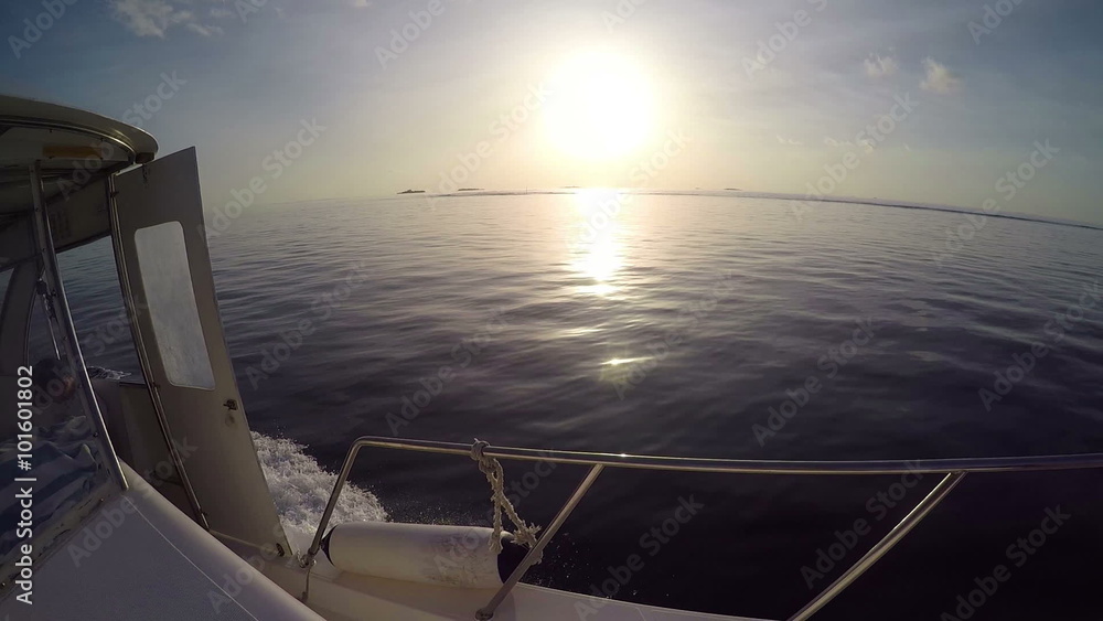 Sailing in the wind through the waves during sunset (HD) Sailing boat shot in full HD at the Sailing in the Maldives Sea. Sailing in the wind through the waves during sunset (HD) Sailing boat shot in full HD at the Sailing in the Maldives Sea.