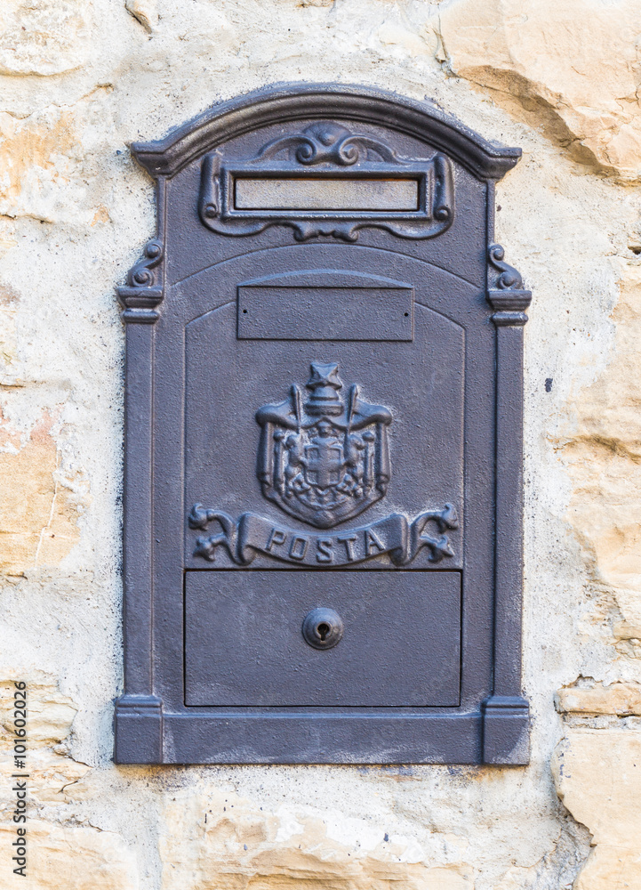 Iron mailbox walled