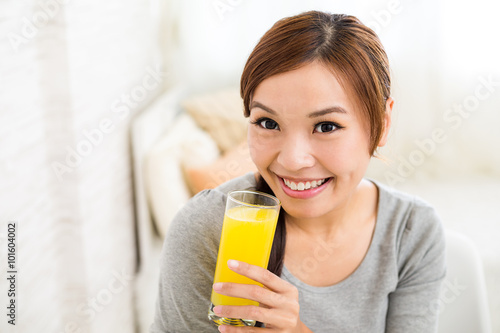 Woman enjoy her orange juice
