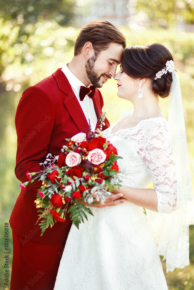 Elegant Couple with Blue Suit and Ball Gown Wedding Dress