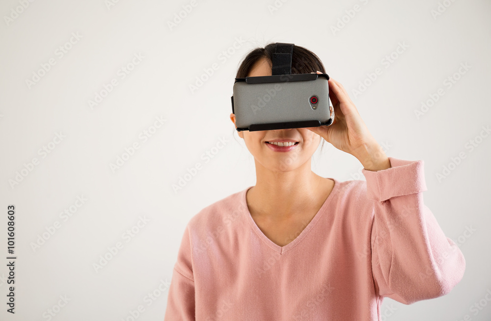 Woman watching via virtual reality glasses