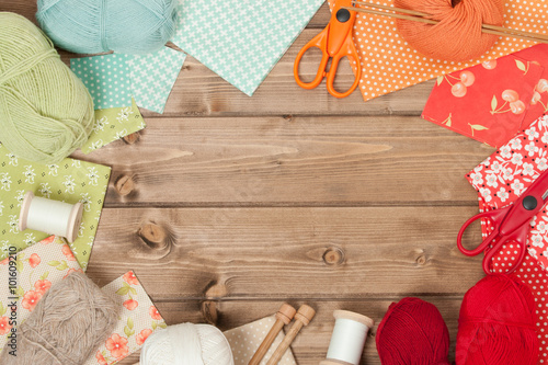 Sewing And Knitting Accessories. Fabric, Yarn Balls. Wooden Tabl