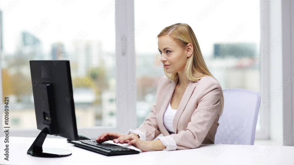 young businesswoman with computer typing at office young businesswoman with computer typing at office