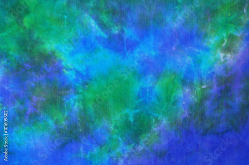 Beautiful blue and green tie dye silk fabric background