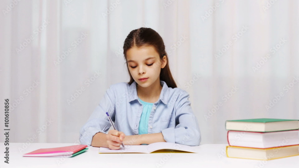 school girl hand writing math task to notepad school girl hand writing math task to notepad
