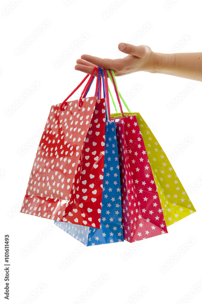 Hand is holding colorful shopping bags
