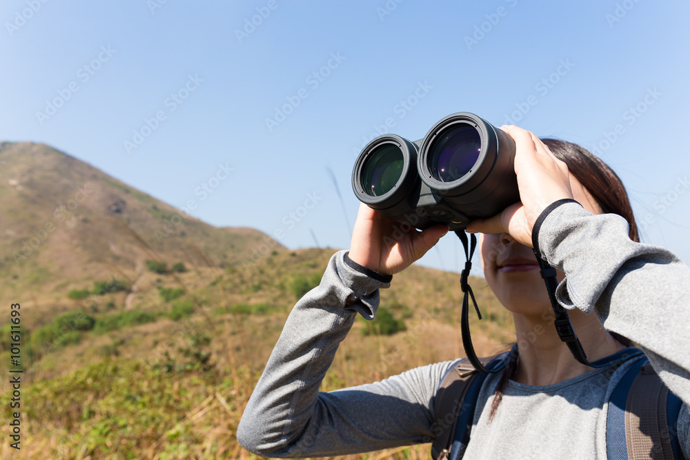 Tourist looking through binoculars Tourist looking through binoculars
