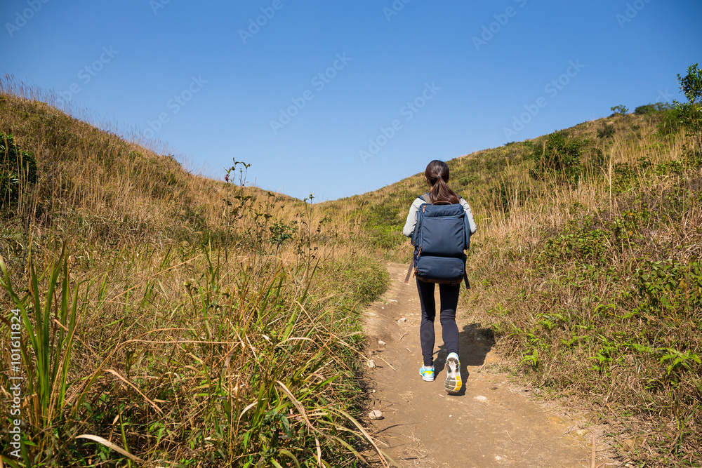 Rear view of woman go hiking Rear view of woman go hiking