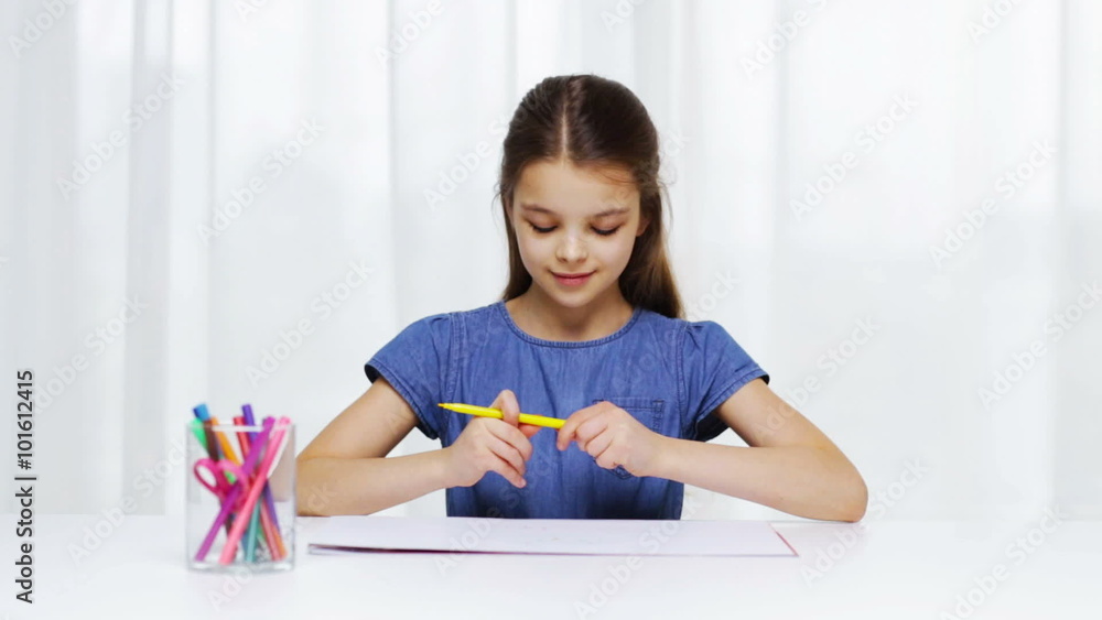 happy girl drawing with felt-tip pencils at home happy girl drawing with felt-tip pencils at home