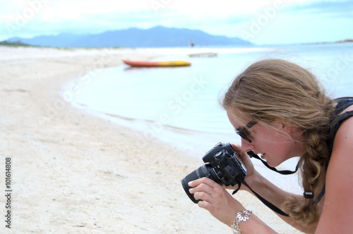 Young smiling woman taking photos in the Caribbean :) photo