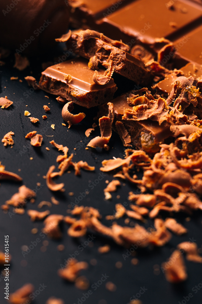 Many candy and chocolate chips on a black background Many candy and chocolate chips on a black background