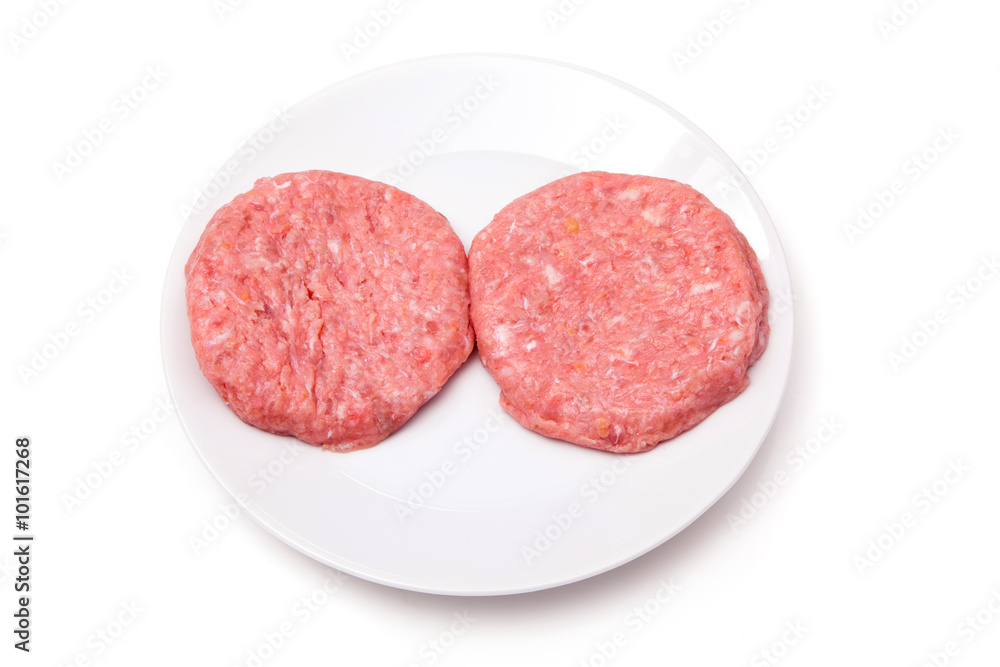 Raw crocodile meat burgers isolated on a white studio background Raw crocodile meat burgers isolated on a white studio background