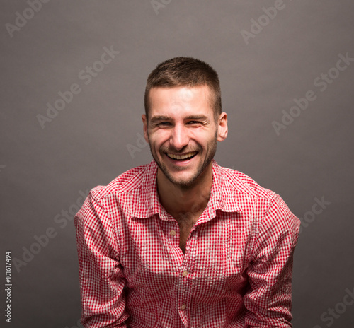 Smiling model man in studio © Svyatoslav Lypynskyy
