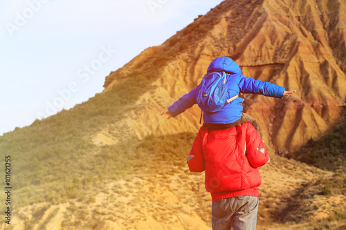 father and son travel in scenic mountains